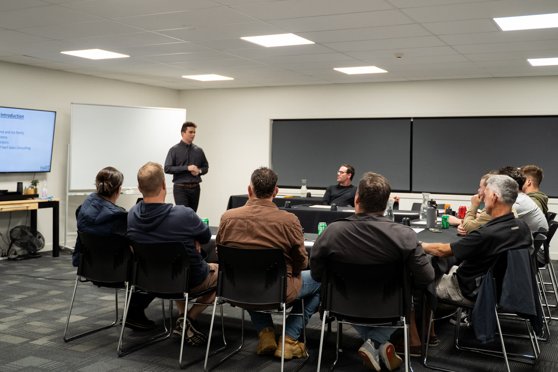 Nathaniel Hart leading a group workshop with a client team